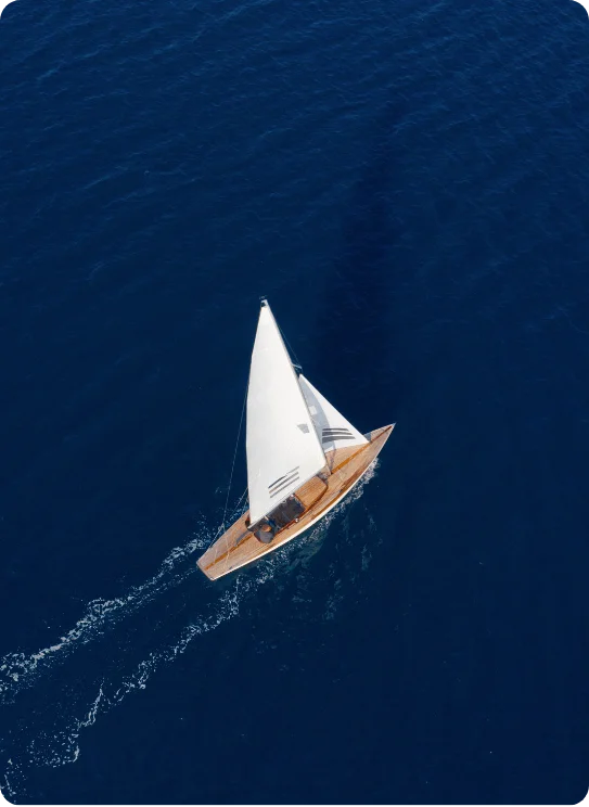 Boat navigating through open ocean